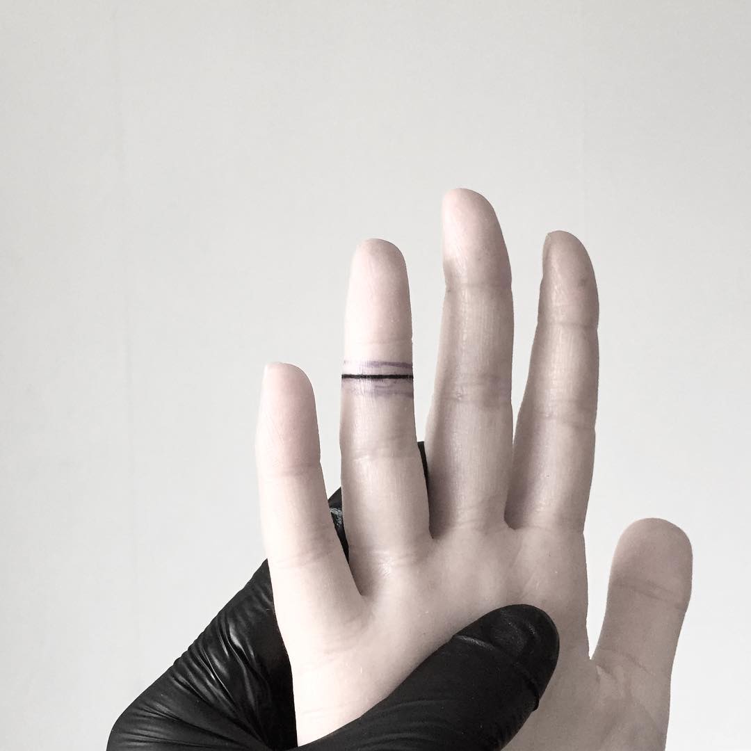 Ruler tattoo on the index finger - Tattoogrid.net