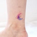 Watercolor moon on an ankle by tattooist Nemo