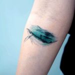Watercolor whale tattoo underwater by Studio Bysol