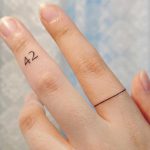 42 tattoo by tattooist Cozy