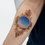 Antique frame tattoo by Mumi Ink