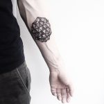 Black geometry on a forearm by Malvina Maria Wisniewska