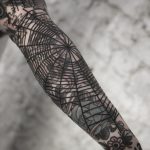 Black spider web by tattooist MAIC