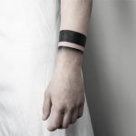 Black wristband by Malvina Maria Wisniewska