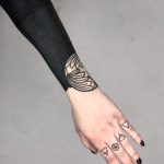 Blackwork forearm piece by tattooist MAIC