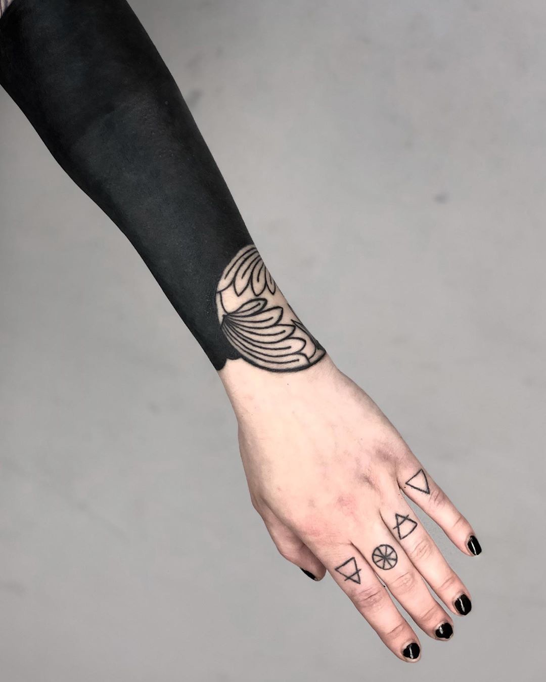 Blackwork forearm piece by tattooist MAIC 