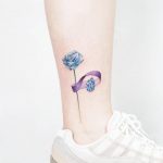 Blue flower and sapphire tattoo by tattooist Ida