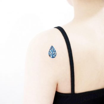 Blue topaz tattoo by tattooist Ida