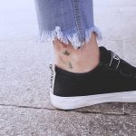 Botanical ankle pieces by tattooist Cozy
