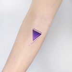 Cover-up purple triangle by tattooist Ida