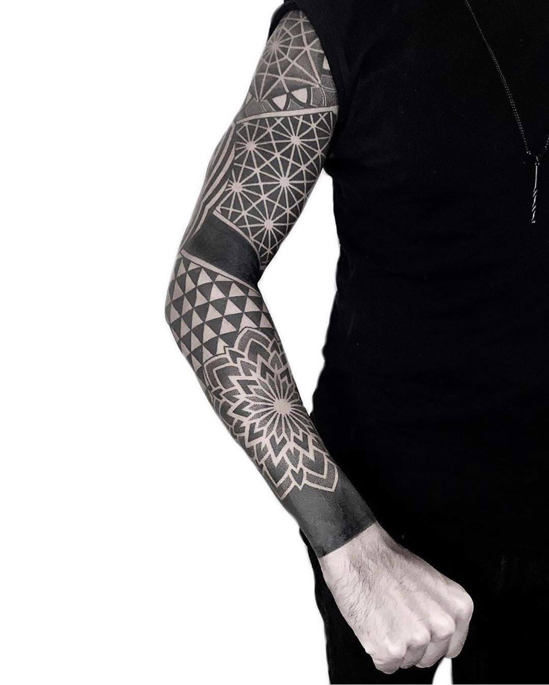 Geometric blackwork sleeve by tattooist NEENO