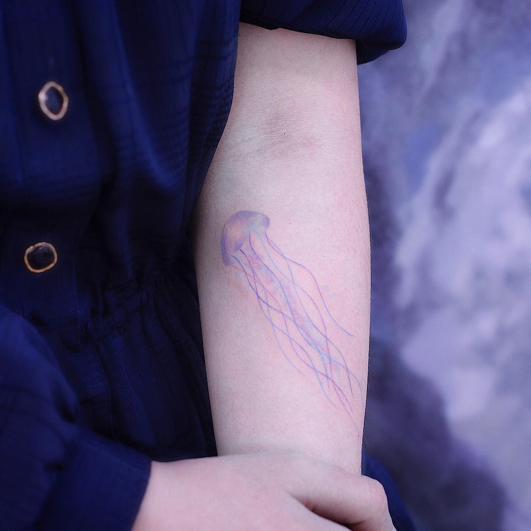 Jellyfish on a forearm by tattooist Saegeem