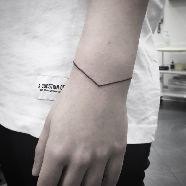 Paper clip tattoo by Sara Kori