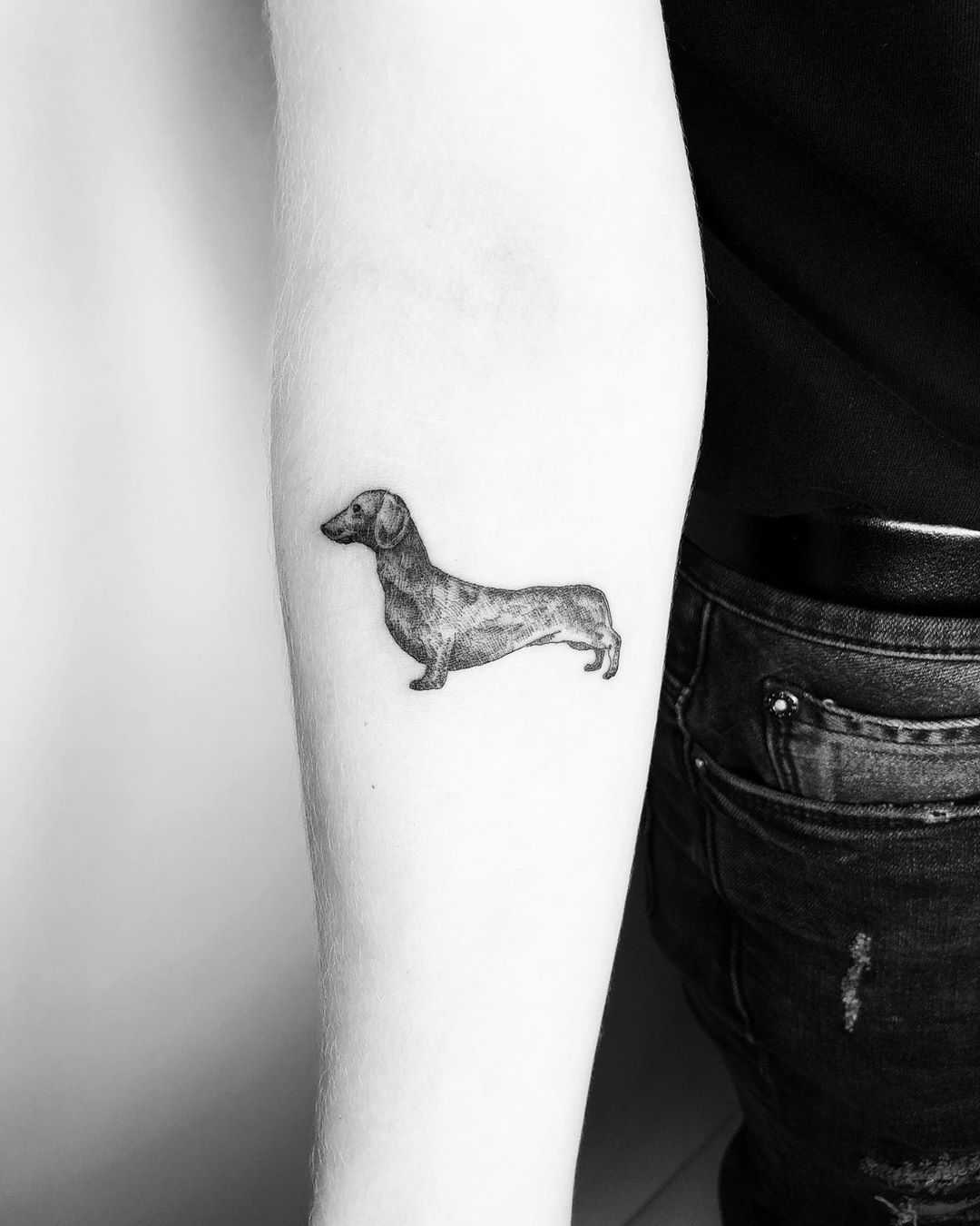 Little dachshund tattoo by Jake Harry Ditchfield