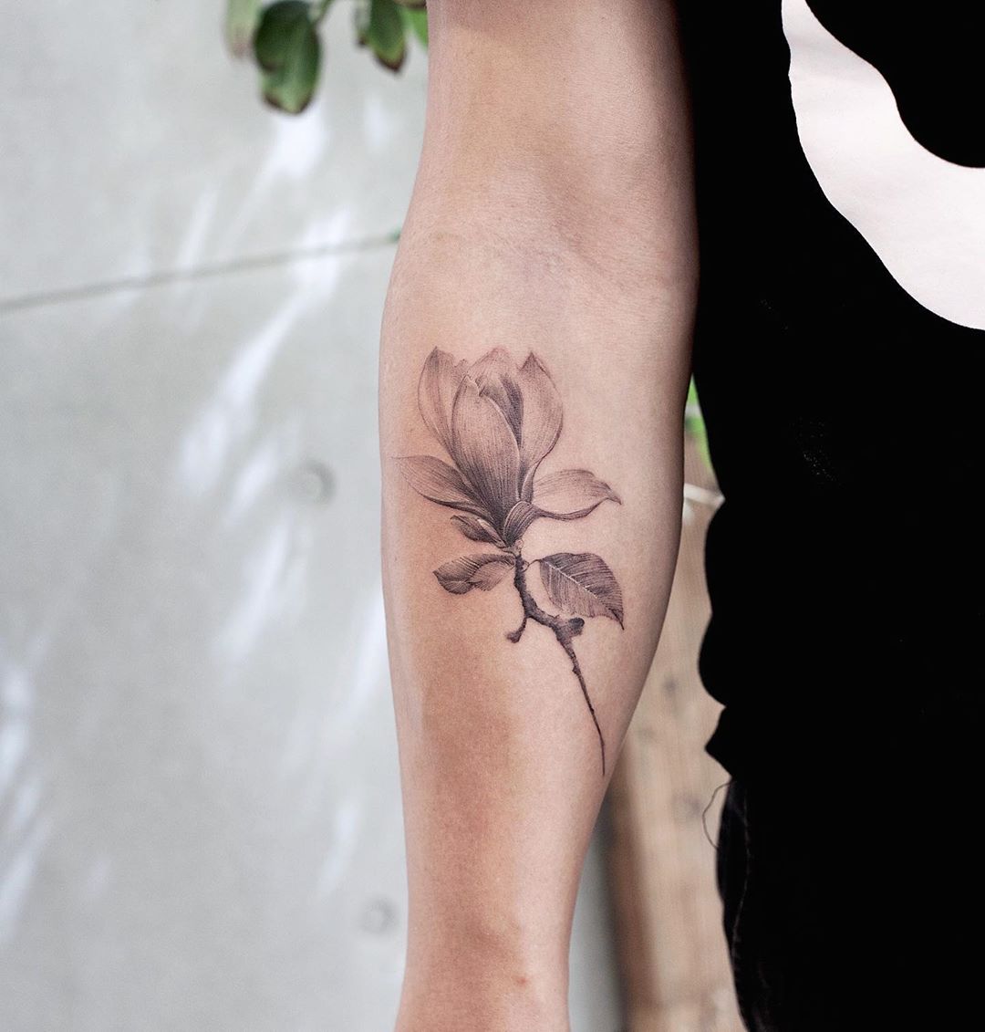Magnolia flower by tattooist Franky