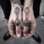 Matching pieces on hands by tattooist Virginia 108