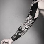 Negative space sleeve by tattooist MAIC