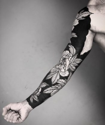 Negative space sleeve by tattooist MAIC