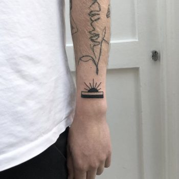 Rising sun tattoo by Rich Sinner