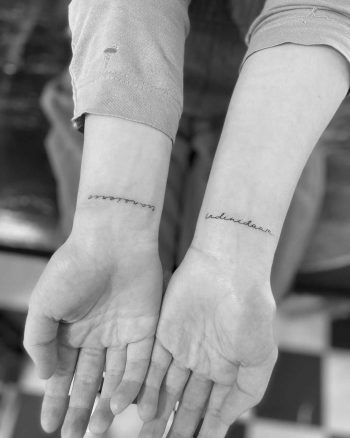 Script on wrists by Oscar Jesus