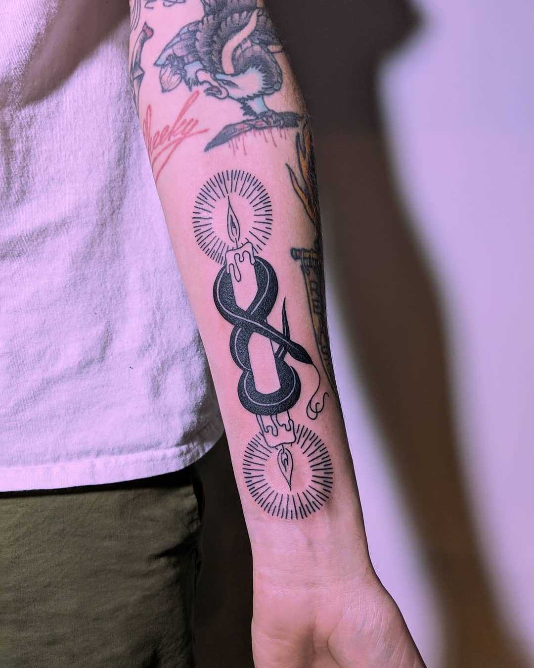 Snake and double ended candle by Tristan Ritter