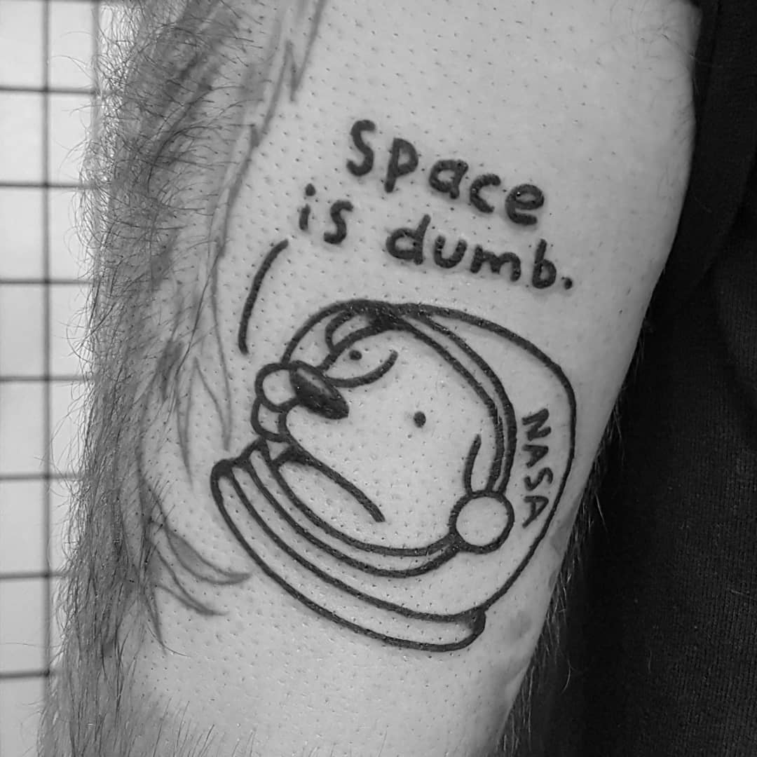 Space is dumb tattoo by tattooist Mr.Heggie