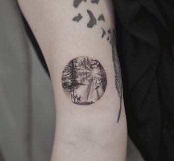 Sun beams trough the trees by tattooist Franky