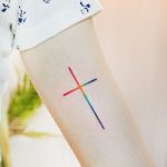 Watercolor cross by tattooist Cozy