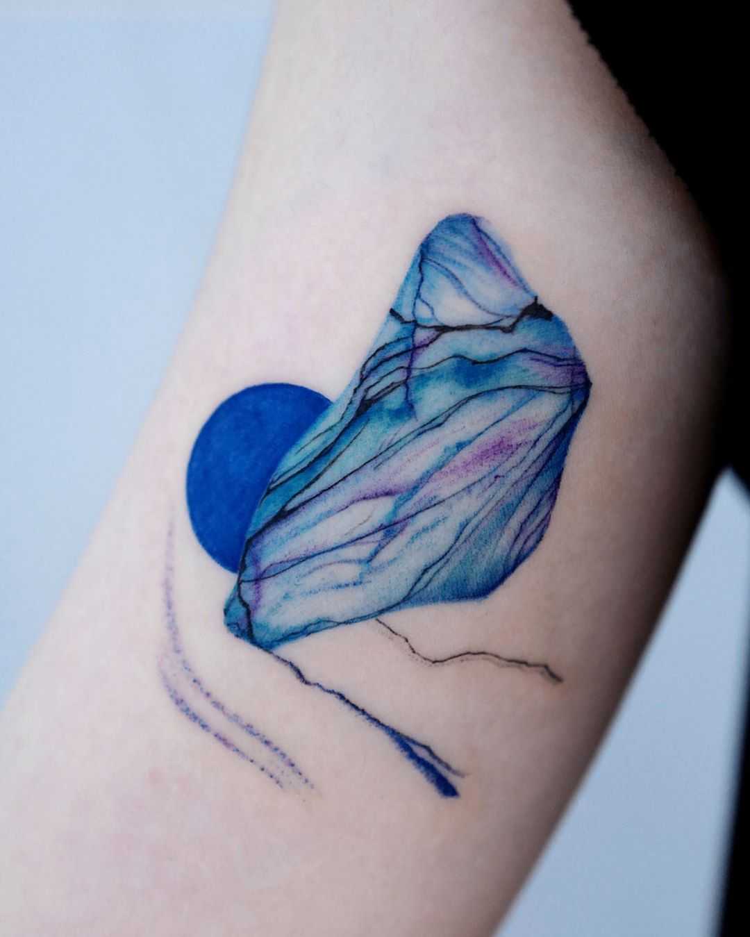 Abstract blue piece by @tattoo_a_piece