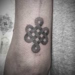 Little tibetan knot tattoo by tattooist Virginia 108