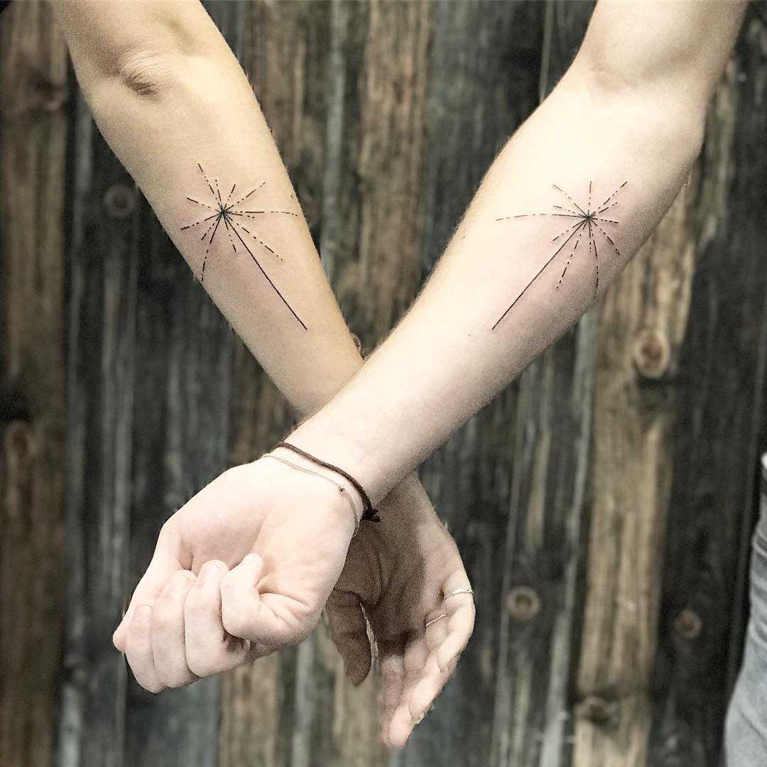 Matching solar map tattoos by Sara Kori