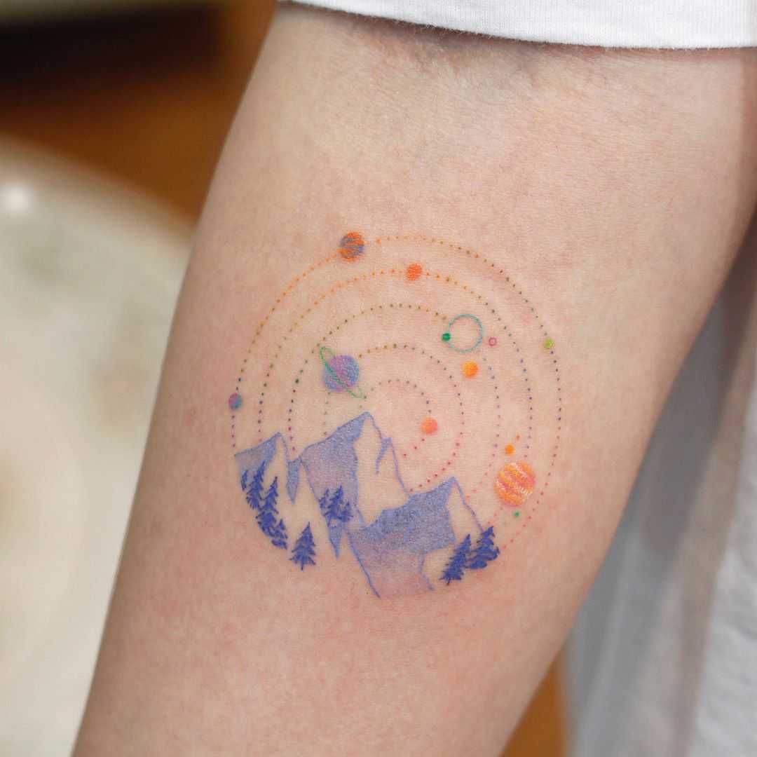 Mountains and planets by tattooist Saegeem