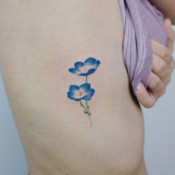 Nemophila flower tattoo by Hakan Adik