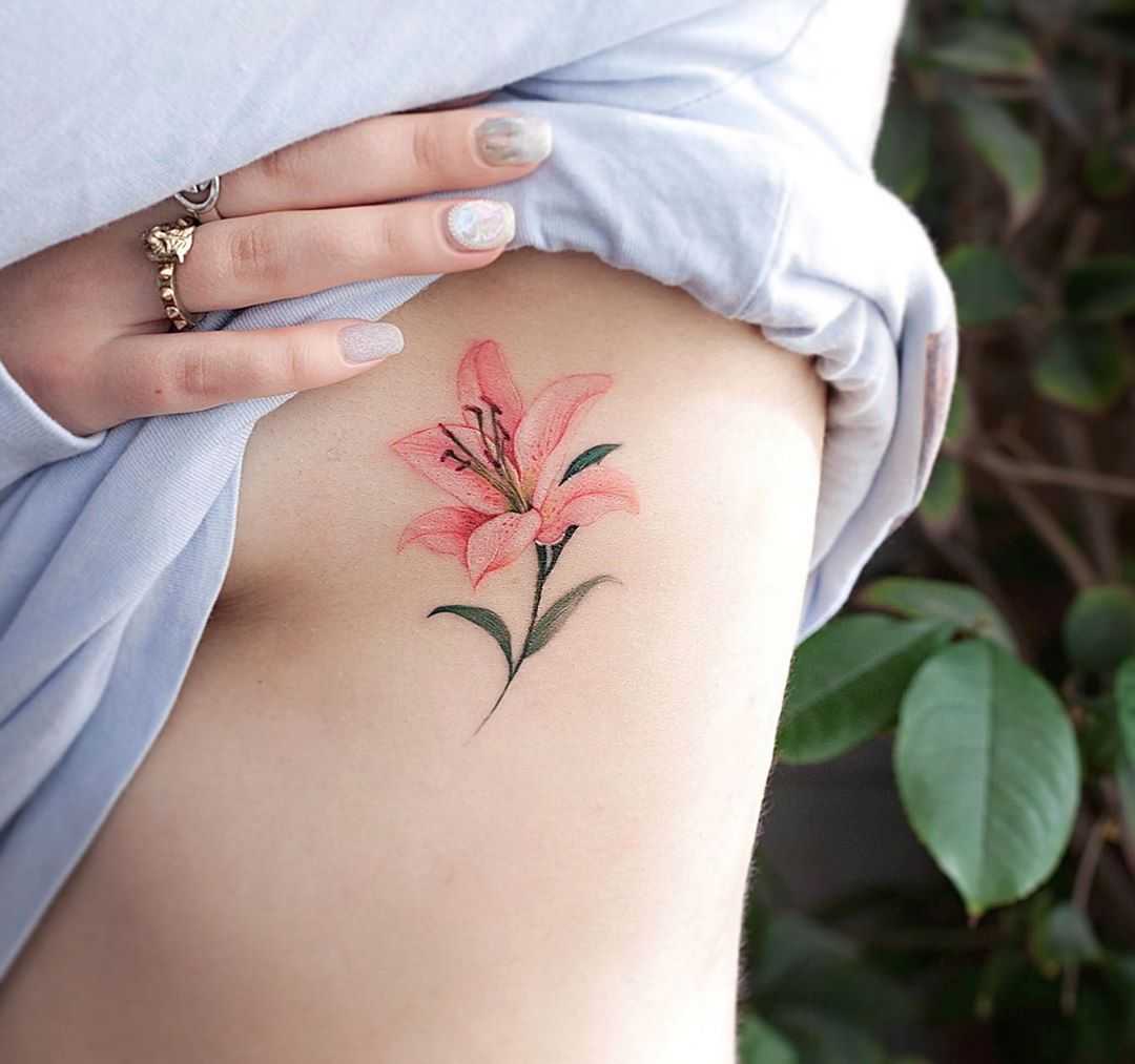 Pink lily tat by tattooist Franky