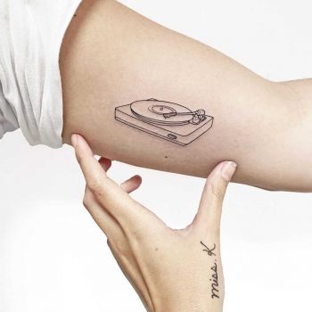 Record player tattoo by Sara Kori
