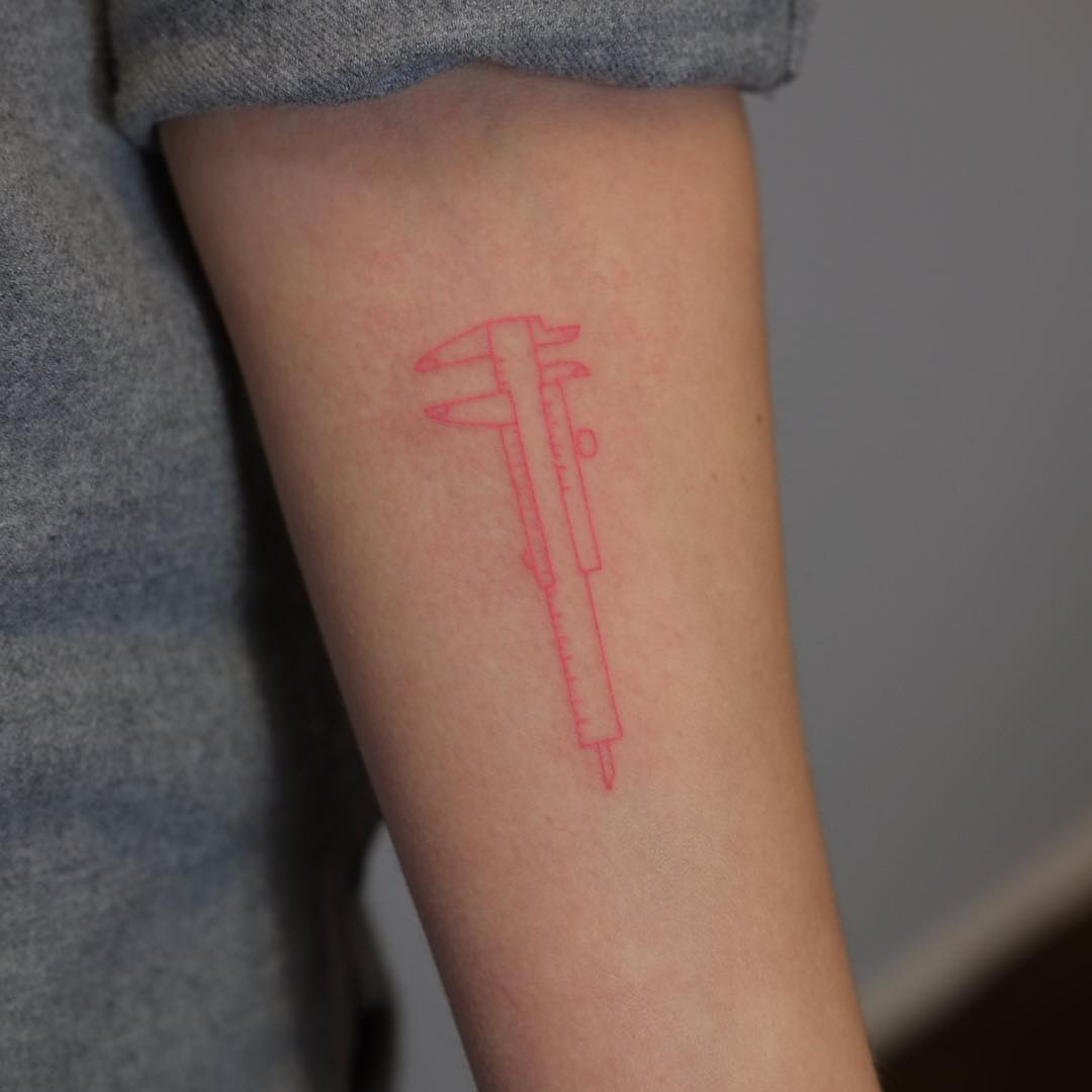 Red caliper tattoo by Yaroslav Putyata