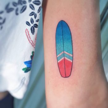 Small surfboard tattoo by @silly_girl_tatts