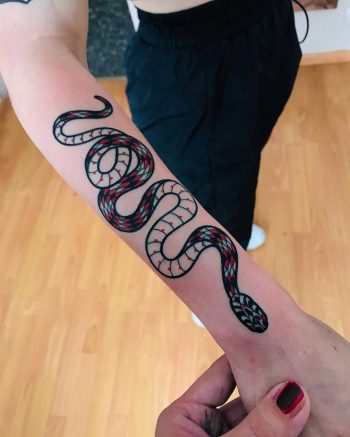 Snake on a forearm by tattooist Alejo GMZ