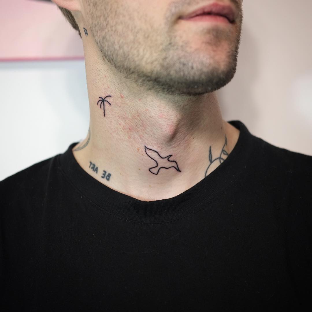 Tiny tattoos on a neck by Yaroslav Putyata