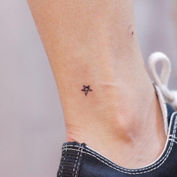 Micro star on an ankle by @wittybutton_tattoo