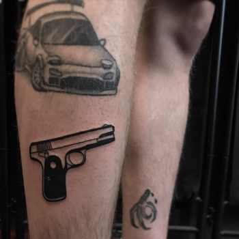 Pistol by @lonewolftattoo