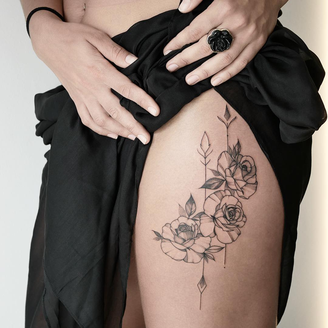 Roses on a thigh by @mariafernandeztattoo