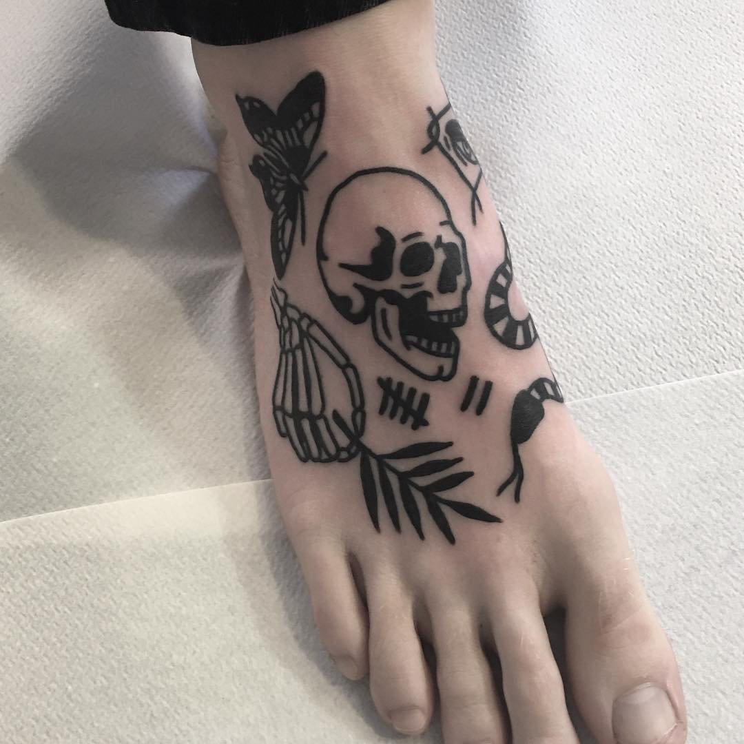Small black tattoos on a foot by @hanaroshinko