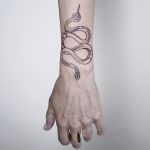 Snake on a forearm by @mariafernandeztattoo