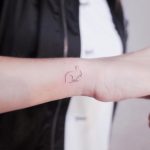 Tiny outline rabbit by @wittybutton_tattoo
