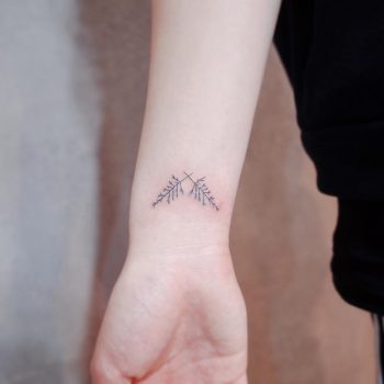 Two tiny branches by @wittybutton_tattoo