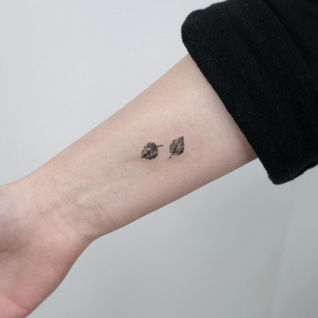 Two tiny leafs by @tattooist_sigak