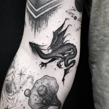 Black dragon by @thomasetattoos