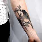 Flannel flowers and Butcherbird tattoo by @sophiabaughan