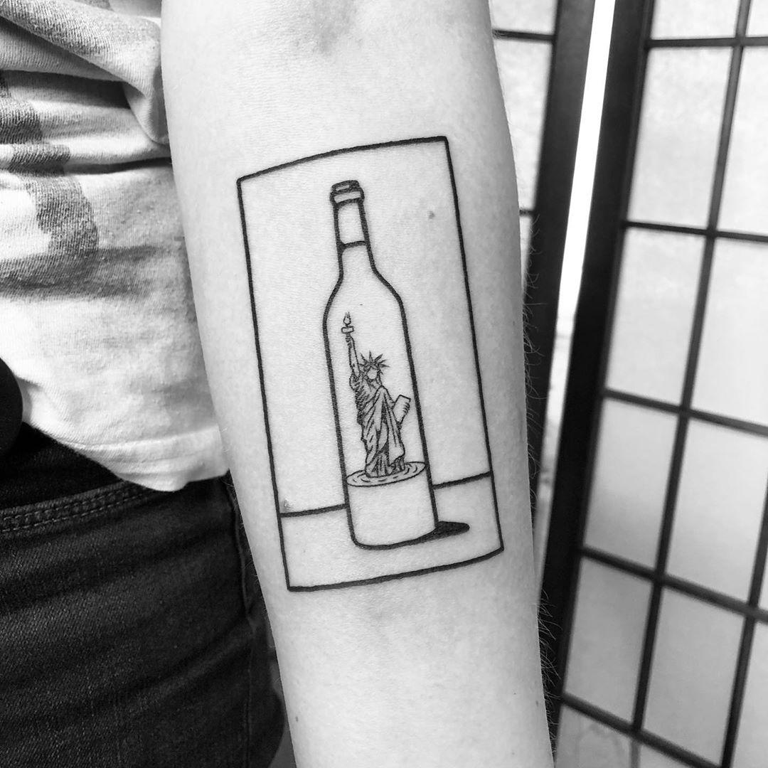 Freedom in a wine bottle by @alexbergertattoo